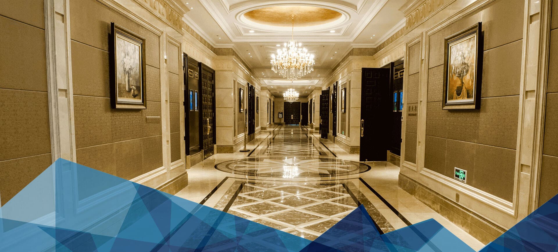 A hallway with many doors and lights in it