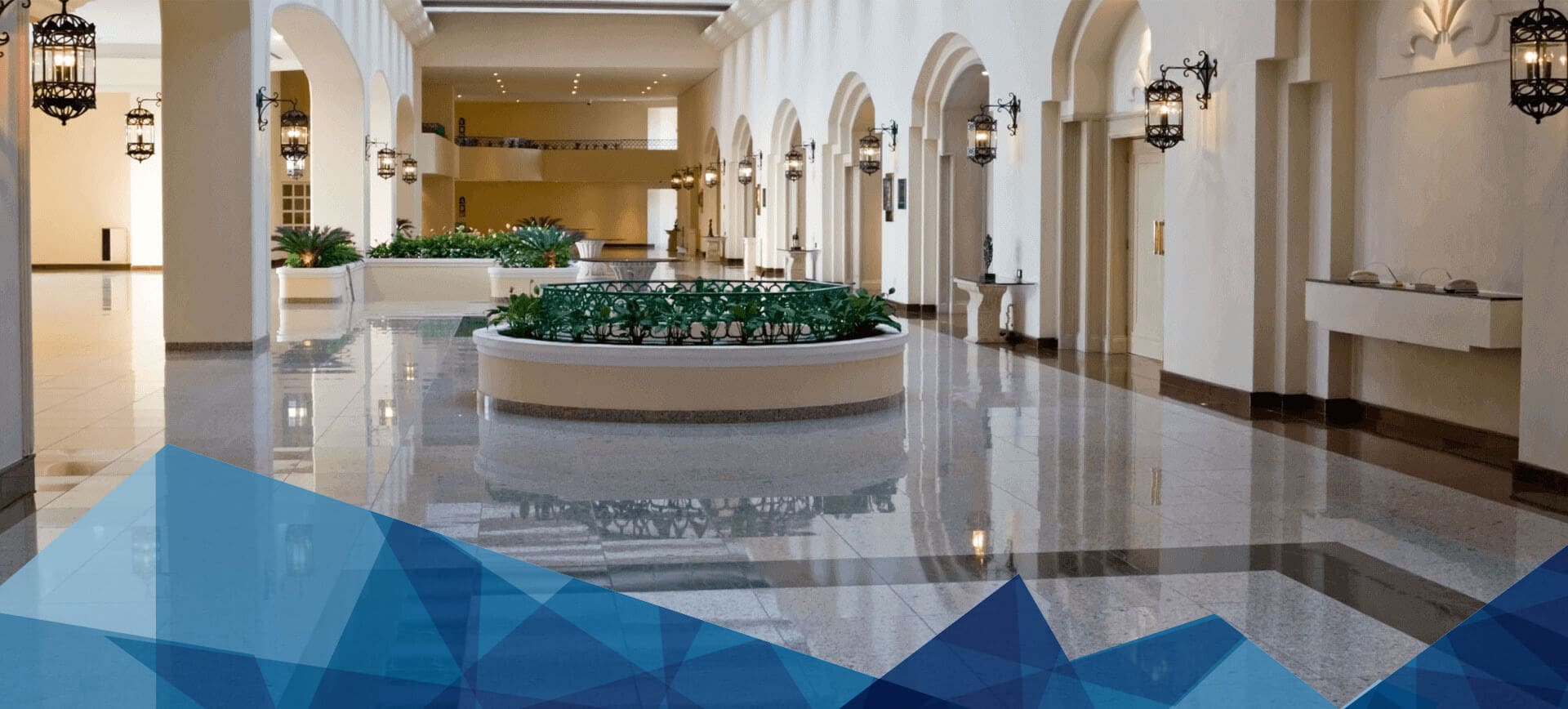 A large room with many windows and plants